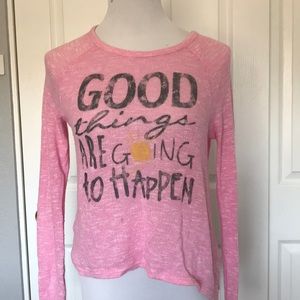 pink long sleeve sweater.